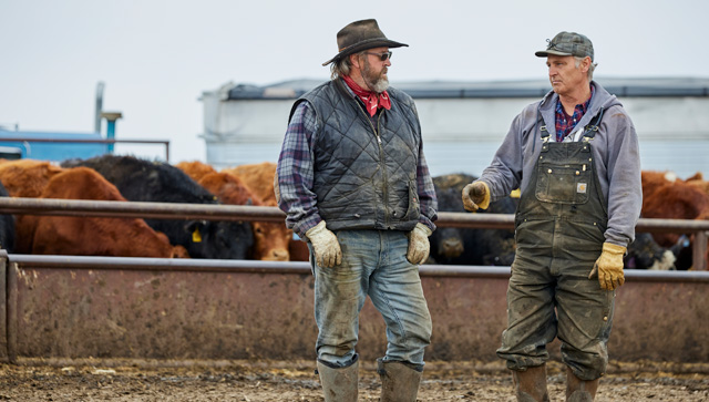 two farmers talking to each other