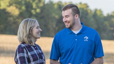 ADM employee talking with grain producer